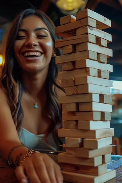 happy woman playing jenga